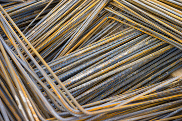 Fototapeta premium Construction materials supply, bundled steel rebar prepared for reinforced concrete structures. Structural steel components, building reinforcement logistics.