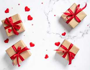 Obraz premium Four brown kraft paper gift boxes with red ribbons and red hearts on a white marble background