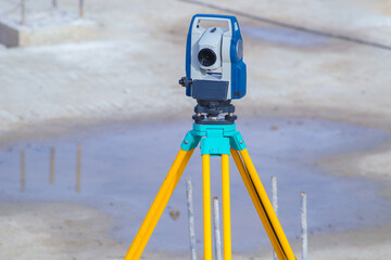 Geodetic monitoring, total station mounted on tripod to measure coordinates during foundation...
