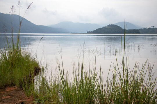 Umiam Lake with misty hills and calm water in Meghalaya