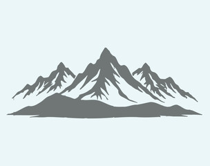 Grey silhouette of rugged mountain range with snow covered peaks