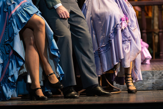 Actors in Vintage Costumes Performing a Cabaret or Period Dance on Stage
