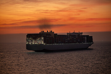 Silhouetted conveys themes of international shipping, maritime industry supply chain and global commerce, making it ideal for business logistics and transportation concepts.