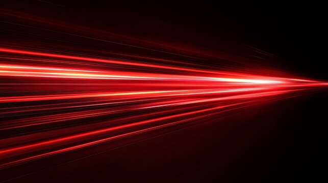 A vibrant red light streaks across a dark background with a sense of speed and motion