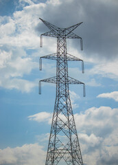 High Voltage Power Transmission Tower Under Blue Sky