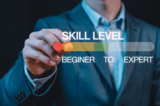 Businessman adjusting skill level slider from beginner to expert
