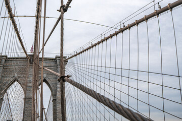 Fototapeta premium The scenic views of the Brooklyn Bridge, which is a cable-stayed suspension bridge in New York City, spanning the East River between the boroughs of Manhattan and Brooklyn.