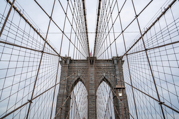 Fototapeta premium The scenic views of the Brooklyn Bridge, which is a cable-stayed suspension bridge in New York City, spanning the East River between the boroughs of Manhattan and Brooklyn.