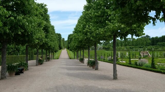 Hiller&oslash;d, Denmark - February 8, 2026: Frederiksborg Castle long gravel path bordered by trees in Hilleroed, Denmark