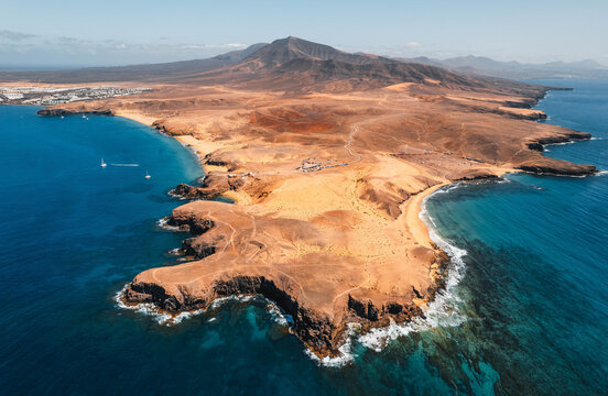 Aerial view of the Papagayo beaches near Yaiza featuring turquoise waters, golden sand coves, and volcanic surroundings on the southern coast of Lanzarote