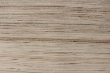 Fototapeta premium Detail of beige Serpeggiante wooden marble texture featuring dense and consistent natural line patterns.