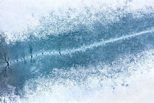 Pressure ridge formation on top of frozen lake