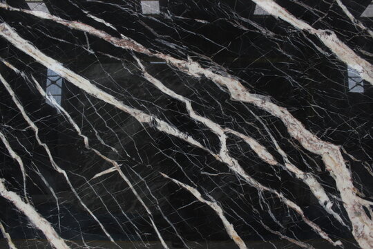 Portoro black marble with majestic gold and white veins, creating a very luxurious and prestigious visual appearance.