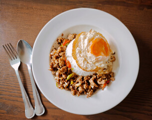 Minced pork stir-fried with garlic and chili, served with a fried egg and steamed rice.