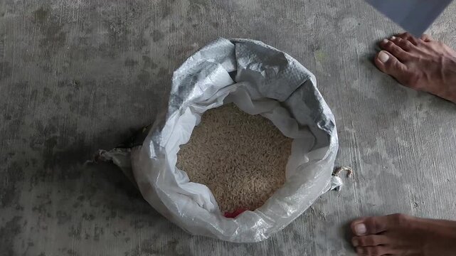 Top view of rice inside a plastic sack prepared for zakat distribution. Symbol of Islamic almsgiving, Ramadan charity.