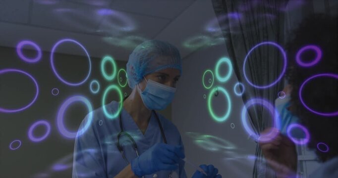 Nurse prepping swab as patient lifting mask, aligning, collecting sample with neon rings overlaying