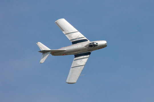 Zeltweg, Austria - September 3, 2022: AIRPOWER22 - Historic Polish Air Force MiG-15 (Lim-2) fighter jet banking in blue sky.