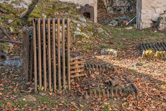Rusted radiators in destroyed and martyred village Oradour sur Glane in France, a massacre in june 1944 during the scecond world war.