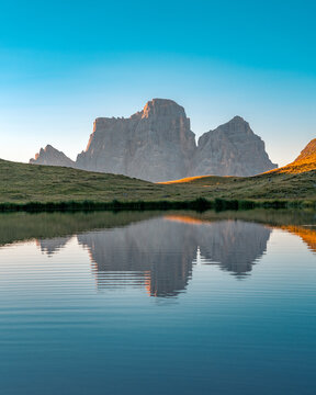 Monte Pelmo reflected on calm Lago delle Baste in Mondeval, Dolomites, Italy