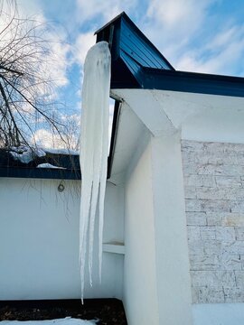 Close-up of large Icicles hanging from the gutter on a building in winter, Bosnia and Herzegovina