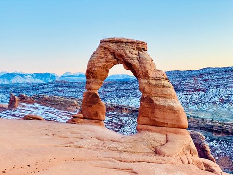 Delicate Arch with a snowy mountain backdrop, Arches National Park, Moab, Utah, USA