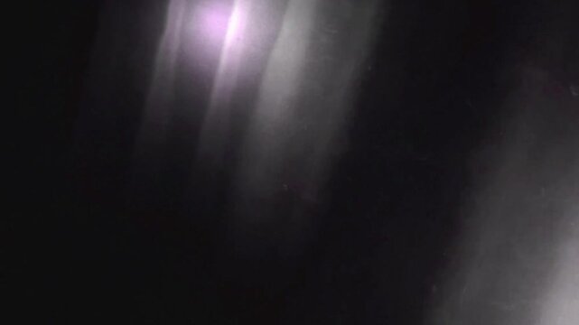 Shadowy Organic Light Leak Overlay, Abstract video frames show dark shadows with light streaks and motion best for mystery movie
