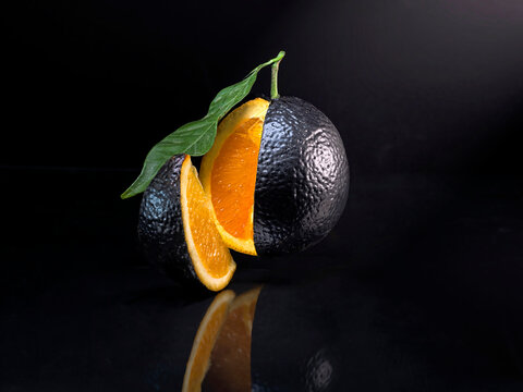 Close-up of a conceptual orange wedge cut of out of an orange with an avocado skin