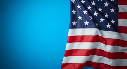 American flag waving against a vibrant blue sky backdrop