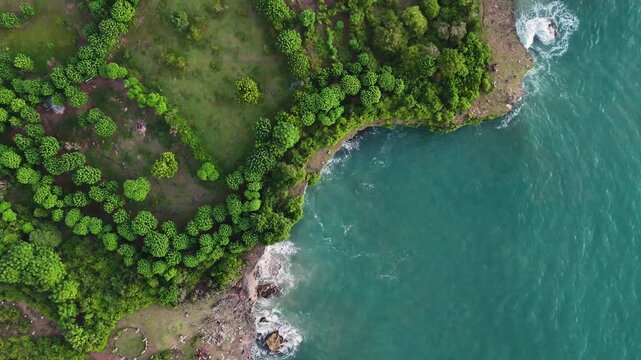 Beautiful coastal cliffs of bizarre shapes with natural arches and wild beaches in the rays of the setting sun. Etretat, France, cliffs on the banks of the English Channel, drone video