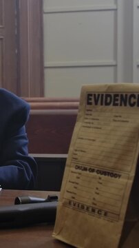 Criminal Trial lawyer in court pointing to notes - modern court room scene