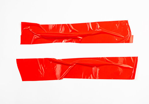 Set abstract sticker tape red color isolated on white background.
Crumpled torn horizontal texture packaging tape box paper.