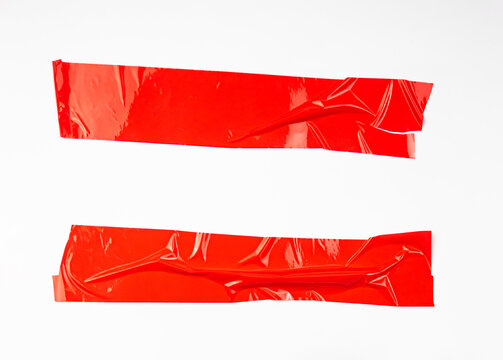 Set abstract sticker tape red color isolated on white background.
Crumpled torn horizontal texture packaging tape box paper.