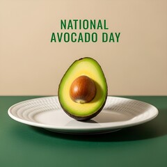 Halfcut avocado with pit on white plate on green surface for national avocado day