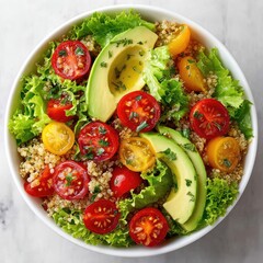 Vibrant Quinoa Salad Bowl with Avocado, Cherry Tomatoes, and Lettuce. Healthy Vegan Meal for Clean Eating, Top View.