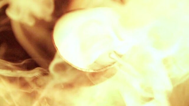 A closeup top view of smoke coming out of a pot, South American shaman medicine ceremony