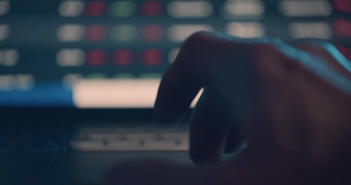 Scrolling through stock market prices on laptop