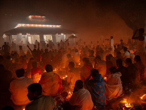 Narayanganj, Bangladesh - 11 November 2025: Aerial view of the bathed in warm light, as people gather near a temple, creating a mystical and intimate scene.