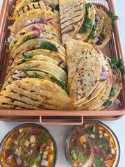 Homemade tacos with consume sauce