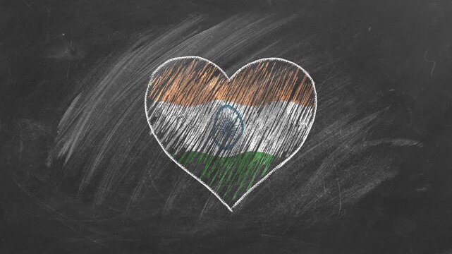 National flag of India in heart shape  drawn with colored chalk on a blackboard. Learning Hindi