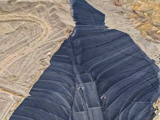 Aerial view of a mineral leaching pad for obtaining gold concentrate in a large-scale mine © WILL PHOTOGRAPHY