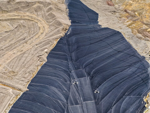 Aerial view of a mineral leaching pad for obtaining gold concentrate in a large-scale mine