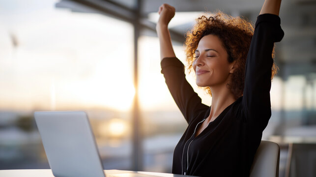 Freelancer finishing workday and closing laptop, satisfaction and freedom, soft daylight, with copy space