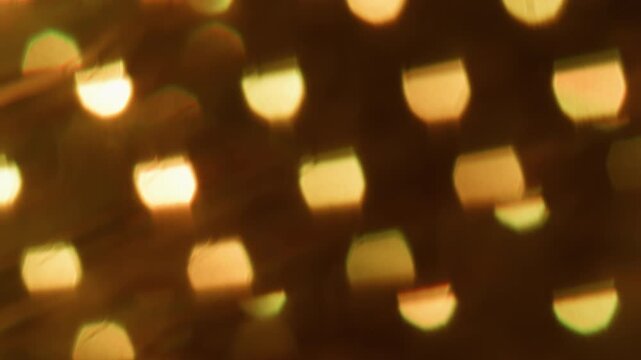 Defocused glow. Shiny texture. Hot orange color round optical vibrant dazzle lens flare on abstract light visual bokeh art background.