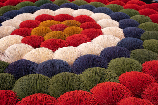 Aerial view of concentric circles of vibrant red, white, blue, green, and yellow hues create a captivating pattern, Ung Hoa, Ha Noi, Vietnam.