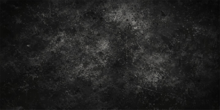 A dark and vintage black and white abstract grunge background featuring a dirty textured wall surface with a rough aged paper pattern for a blank charcoal grey design backdrop
