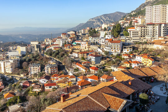 Panoramic view of a hillside residential district with traditional and modern buildings with mountain Balkan landscape, Kruja, Albania