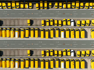 Delivery vans and trucks hub. Fleet of yellow post vehicles