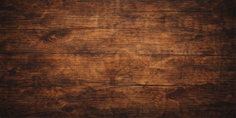 A dark grunge wood texture features a rough natural grain pattern on an old brown timber plank surface, creating a weathered hardwood material backdrop for a rustic wall or floor design © Jisan