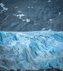 Hikers Walking on Nigardsbreen Glacier in Norway
