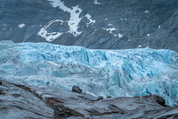 Nigardsbreen Glacier with Blue Ice and Rocky Valley in Norway
